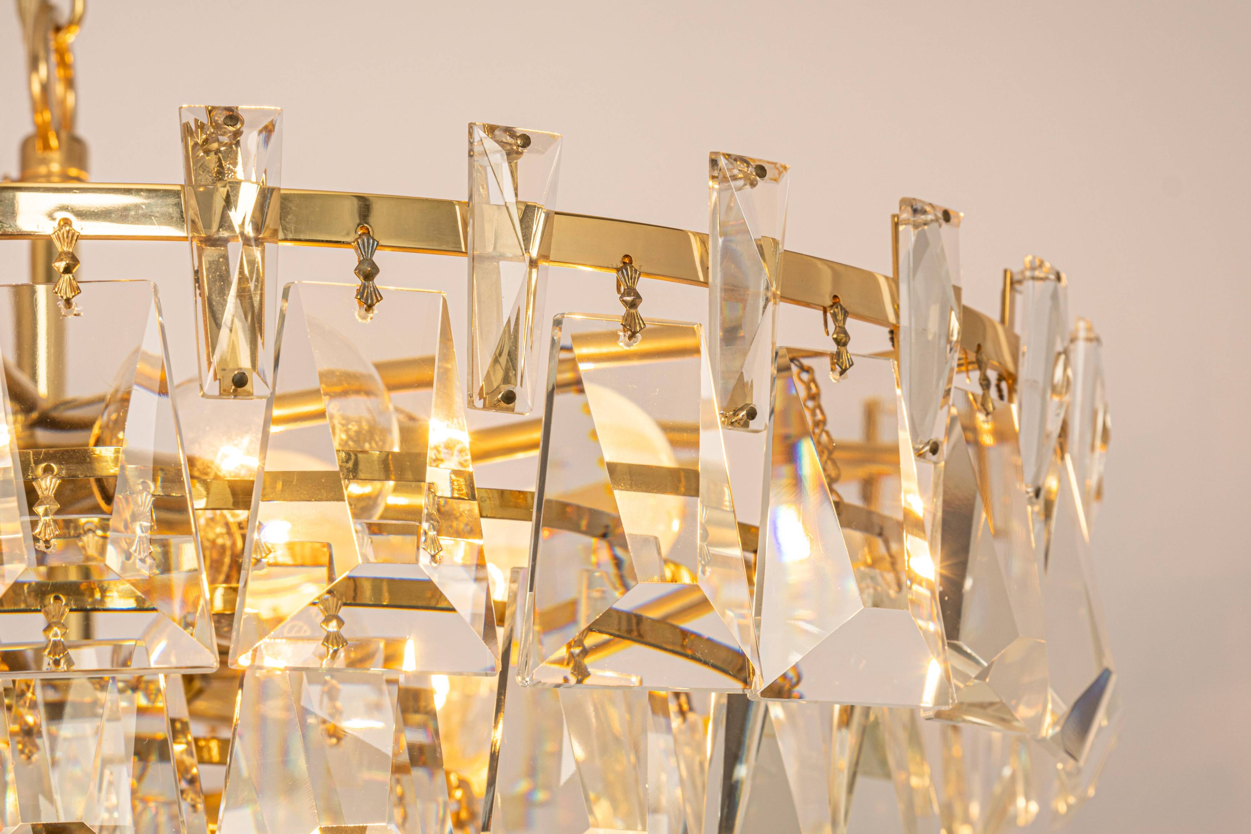 Large chandelier in gilded brass and crystal, by Palwa, Germany, 1970s.