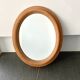 Oval wooden mirror 31x37cm