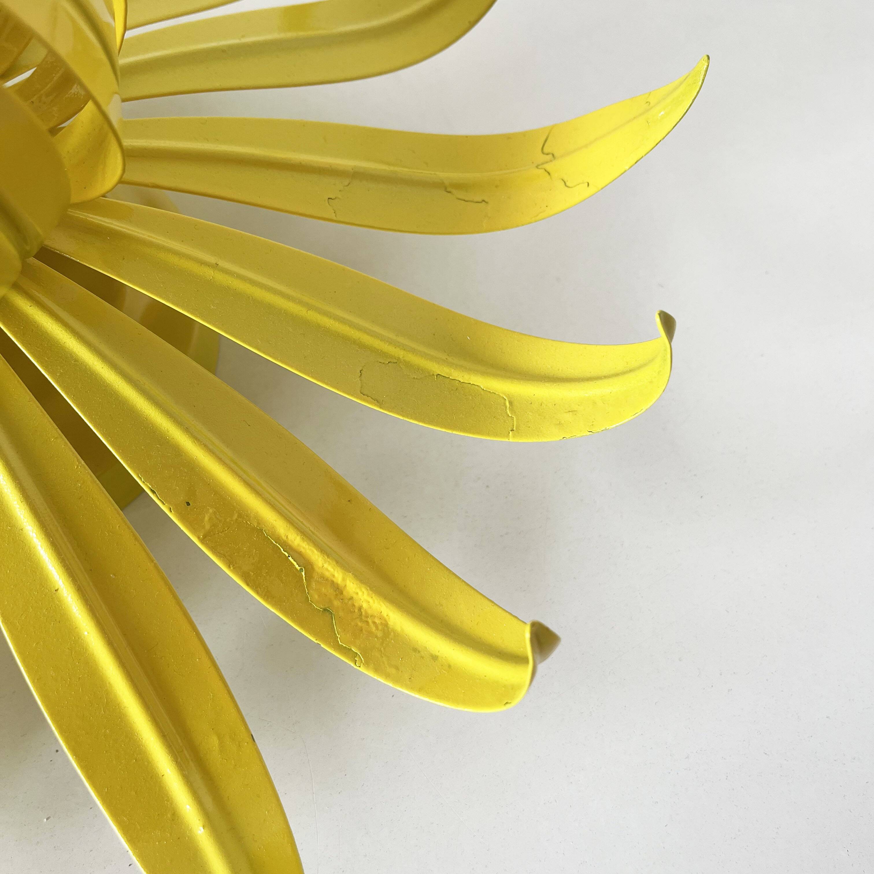 Vintage yellow metal flower wall light