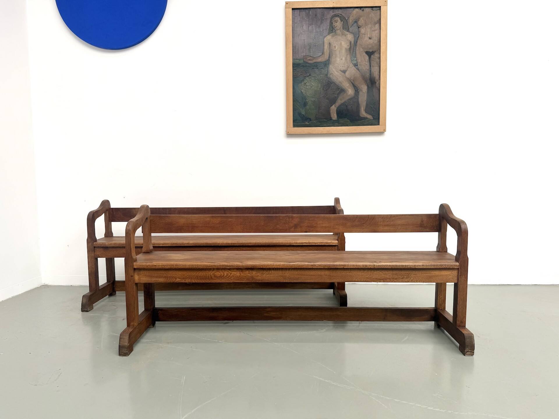 Pair of communal benches in solid oak, 1950s.