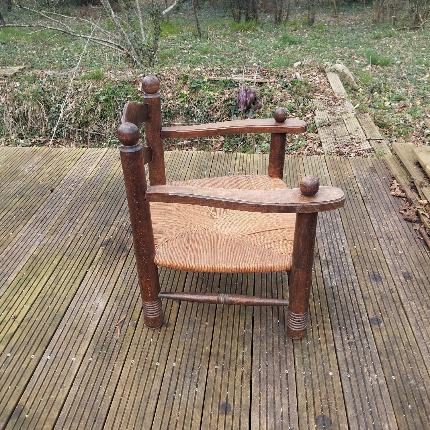 Low straw fireplace armchair in Dudouyt style