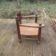 Low straw fireplace armchair in Dudouyt style