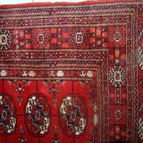 Tapis vintage fait main Tekke en laine rouge (109cm x 112cm) – Années 1970