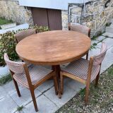 Extendable round dining table and 4 Baumann chairs.