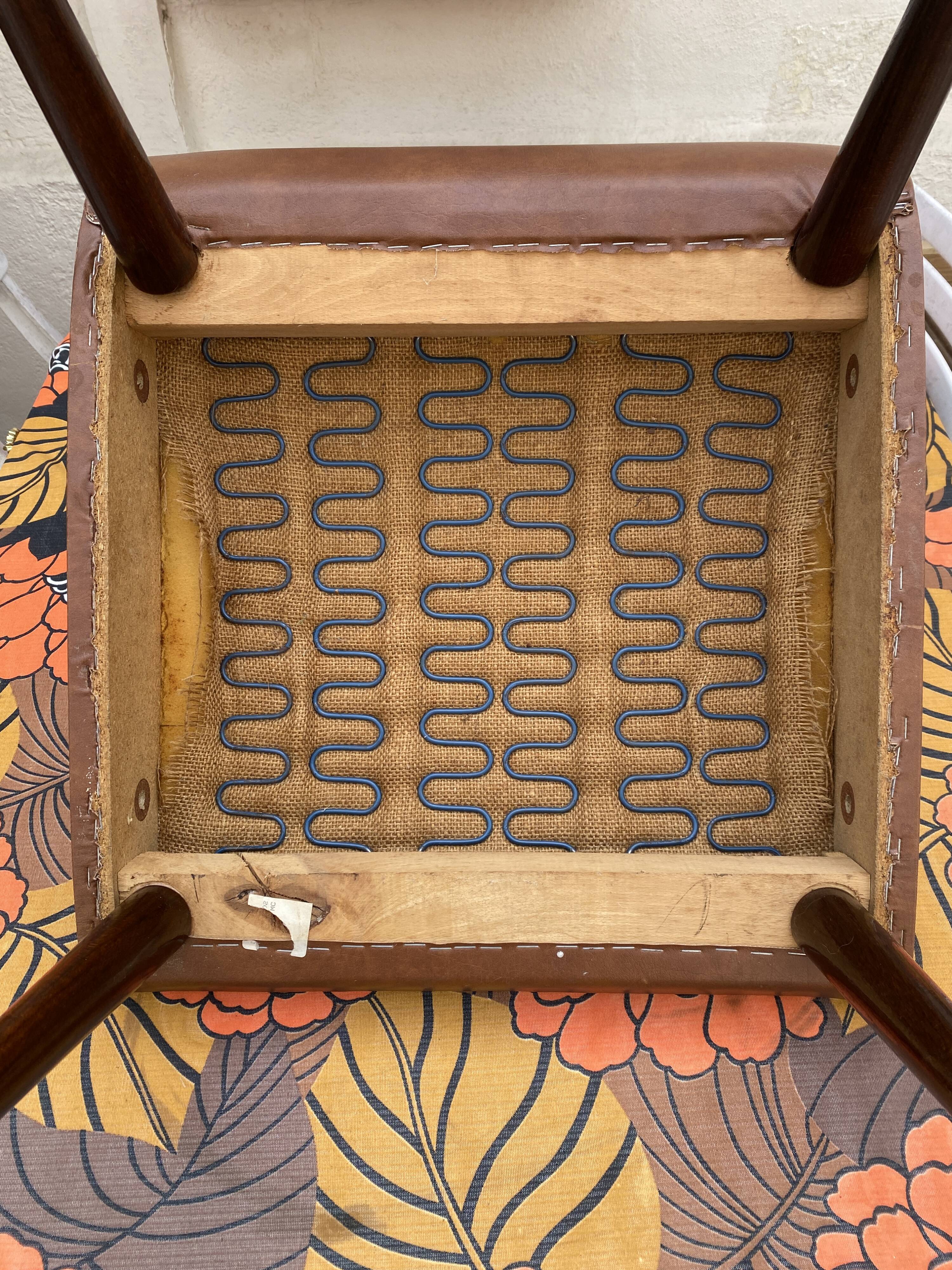 Mid-Century Scandinavian vintage retro armchair with oval armrests.
