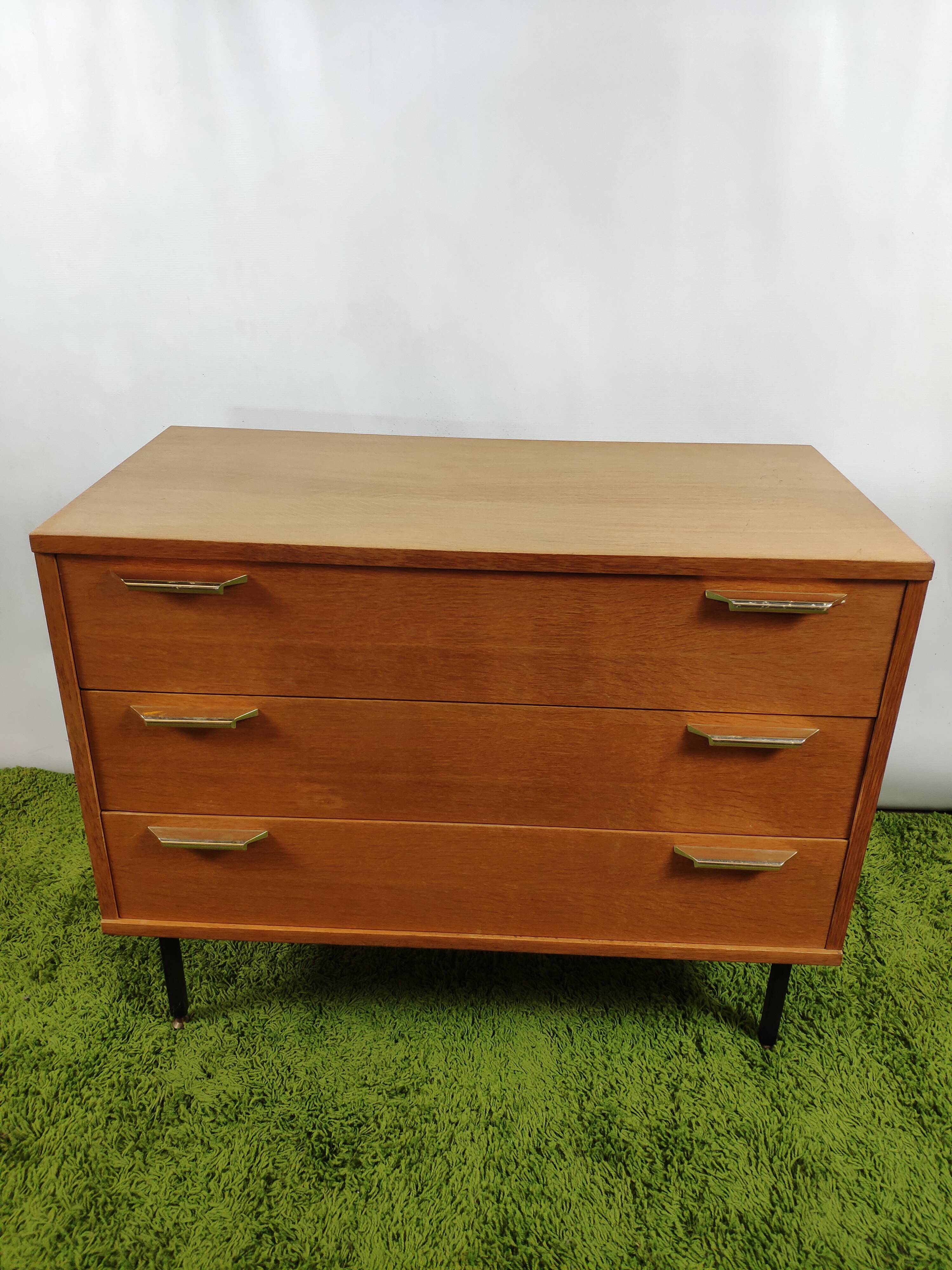 Wooden chest of drawers with gilded handle