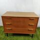 Wooden chest of drawers with gilded handle