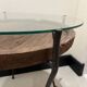decorative wrought iron round table, glass and wood top.