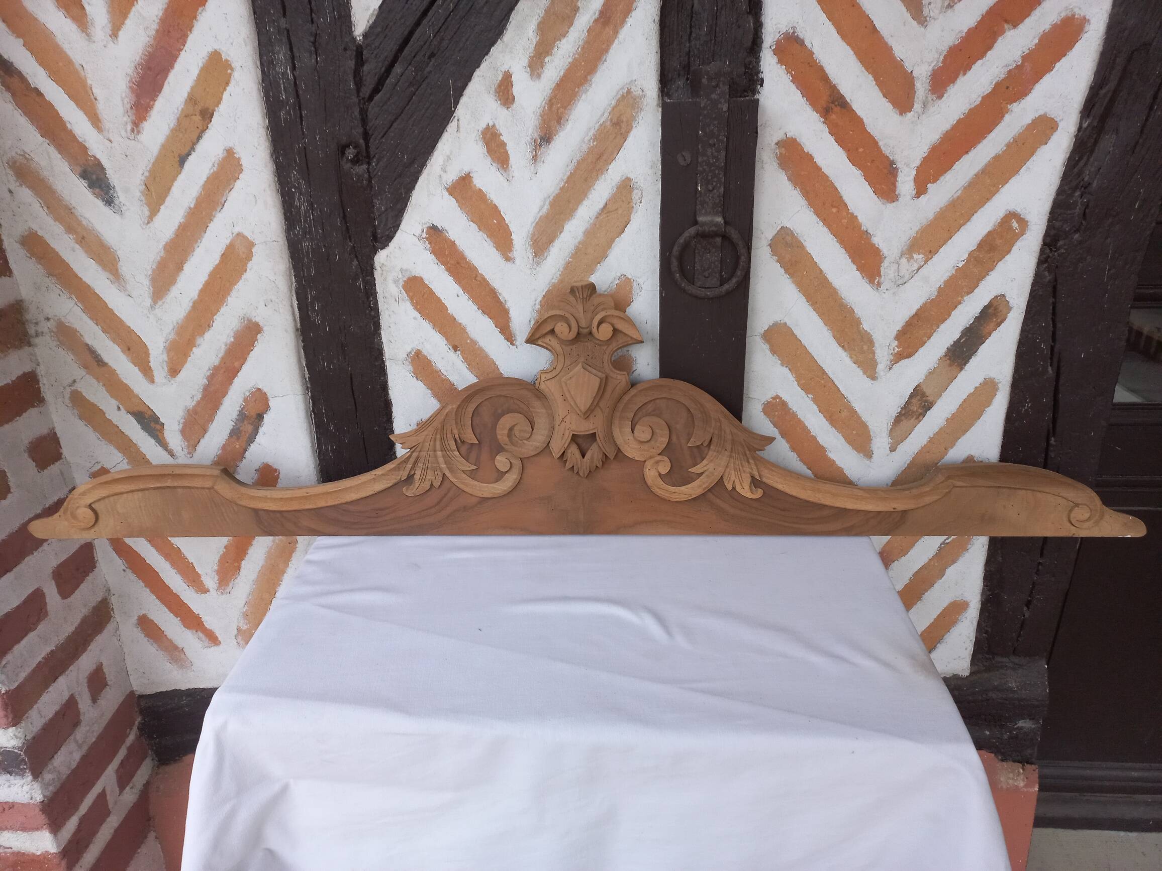 Old sandblasted wooden pediment