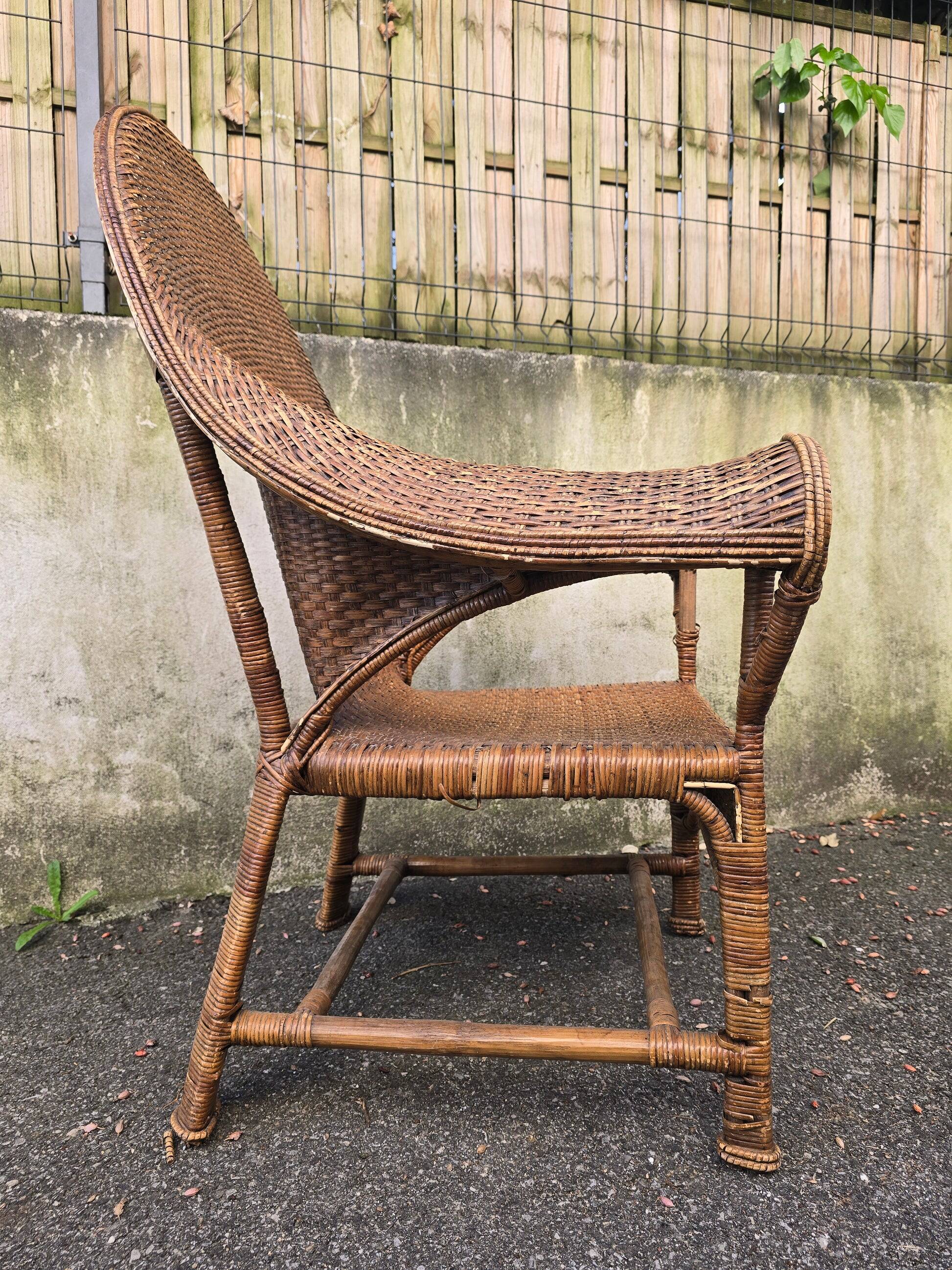 Arts & Crafts armchair in wicker and rattan attributed to Dryad & Co, UK, circa 1920.