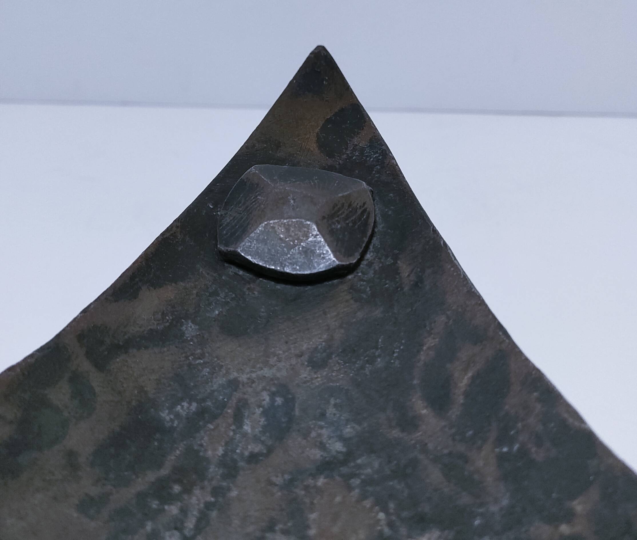 Brutalist metal pocket with patinated tripod