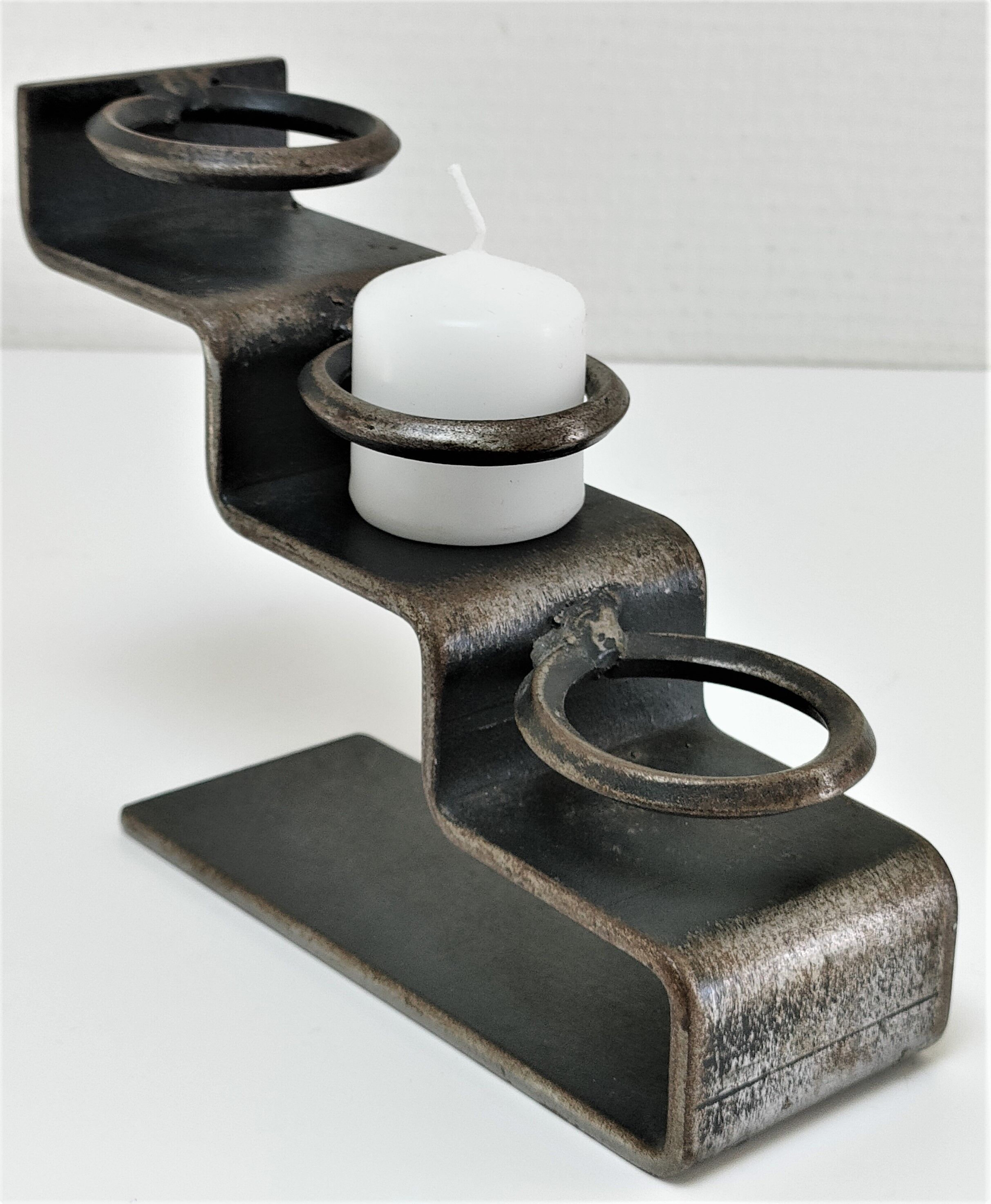 Sculptural candle holder patinated steel design 80s
