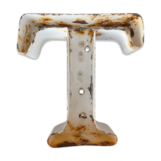 Letter "T" of vintage industrial brand in iron