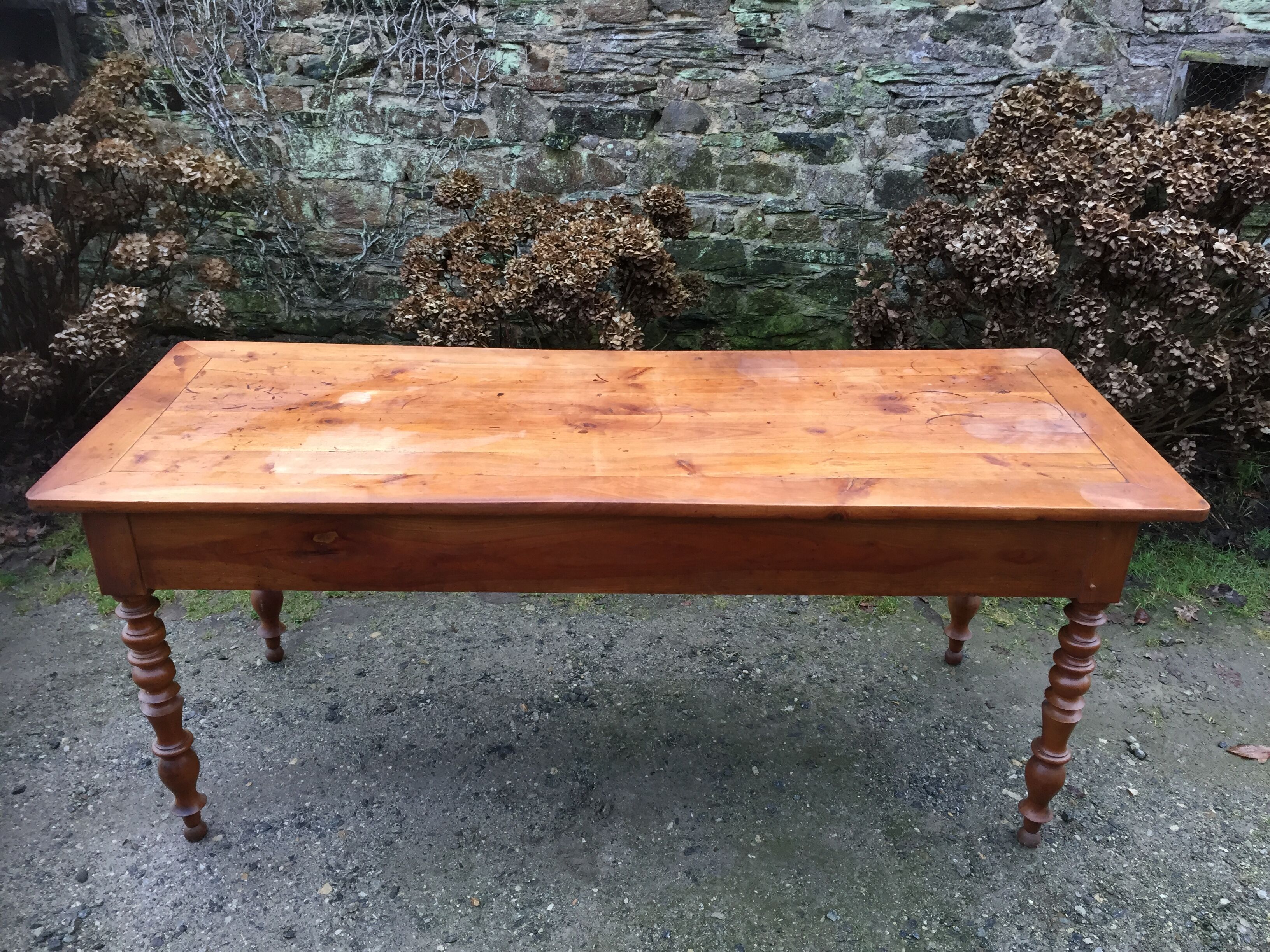 Old cherry farmhouse table with 3 drawers and turned legs