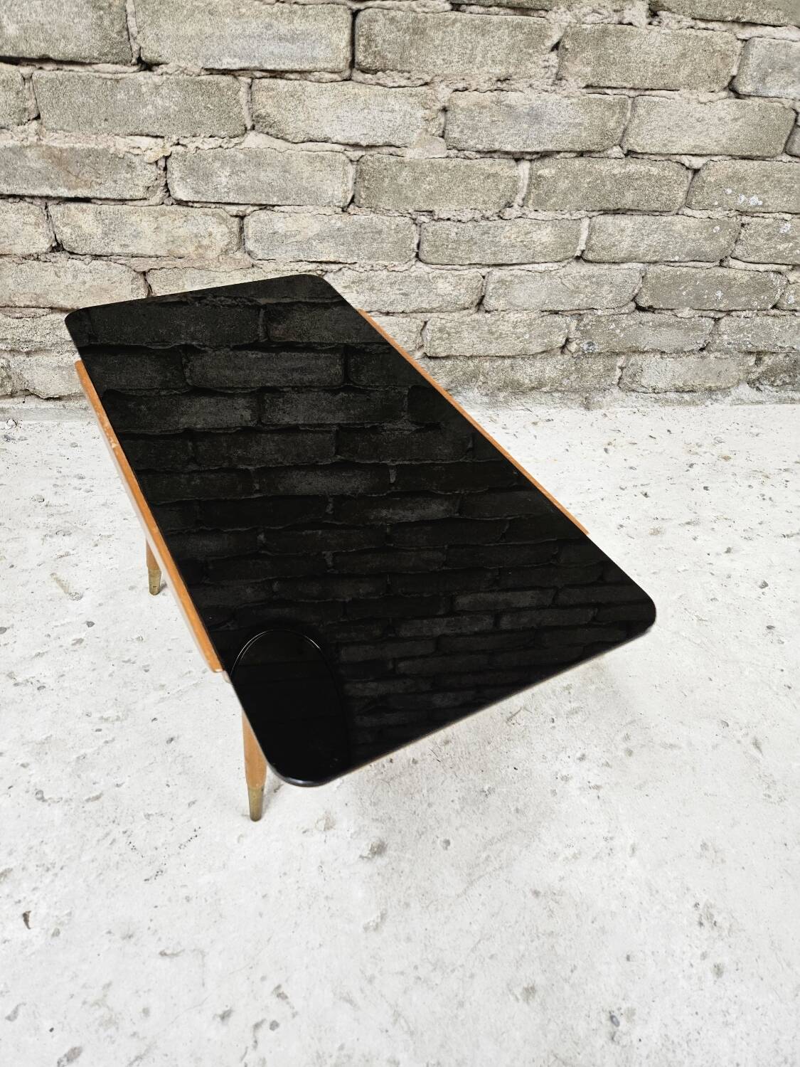 Small opaque black glass coffee table 1960
