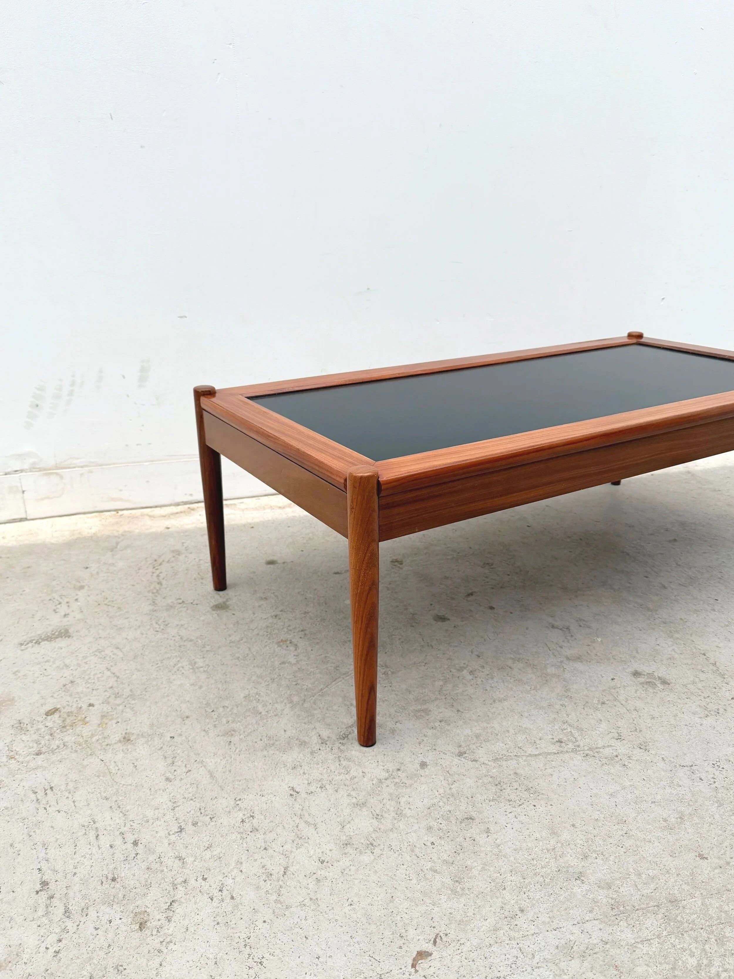 Scandinavian coffee table in teak and black formica, 1960.