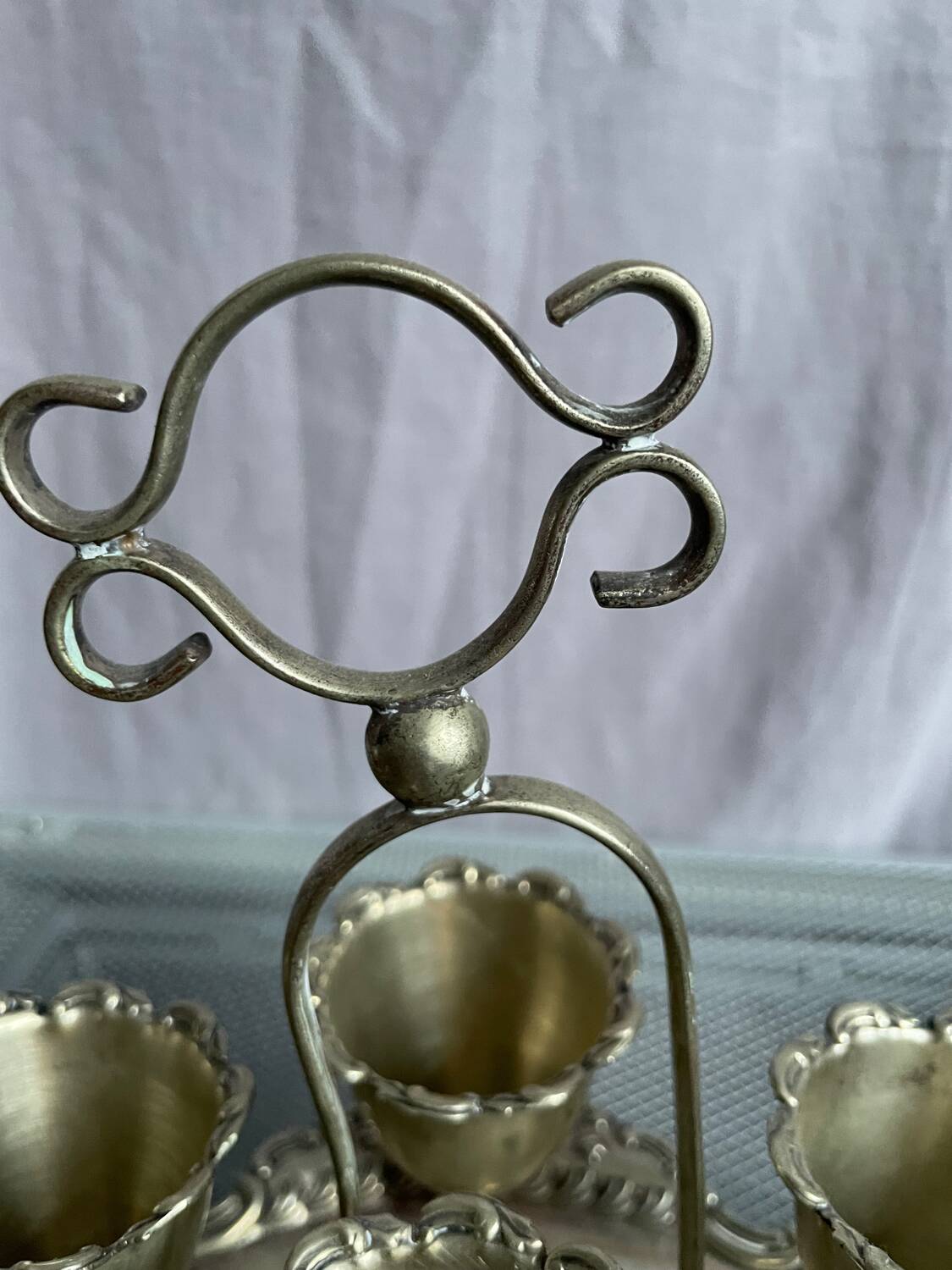 Antique egg set in nickel silver metal
