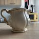 Old cream jug "Nous deux" in Sarreguemines earthenware.