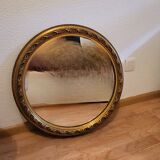 Large round mirror in Spanish gilded carved wood