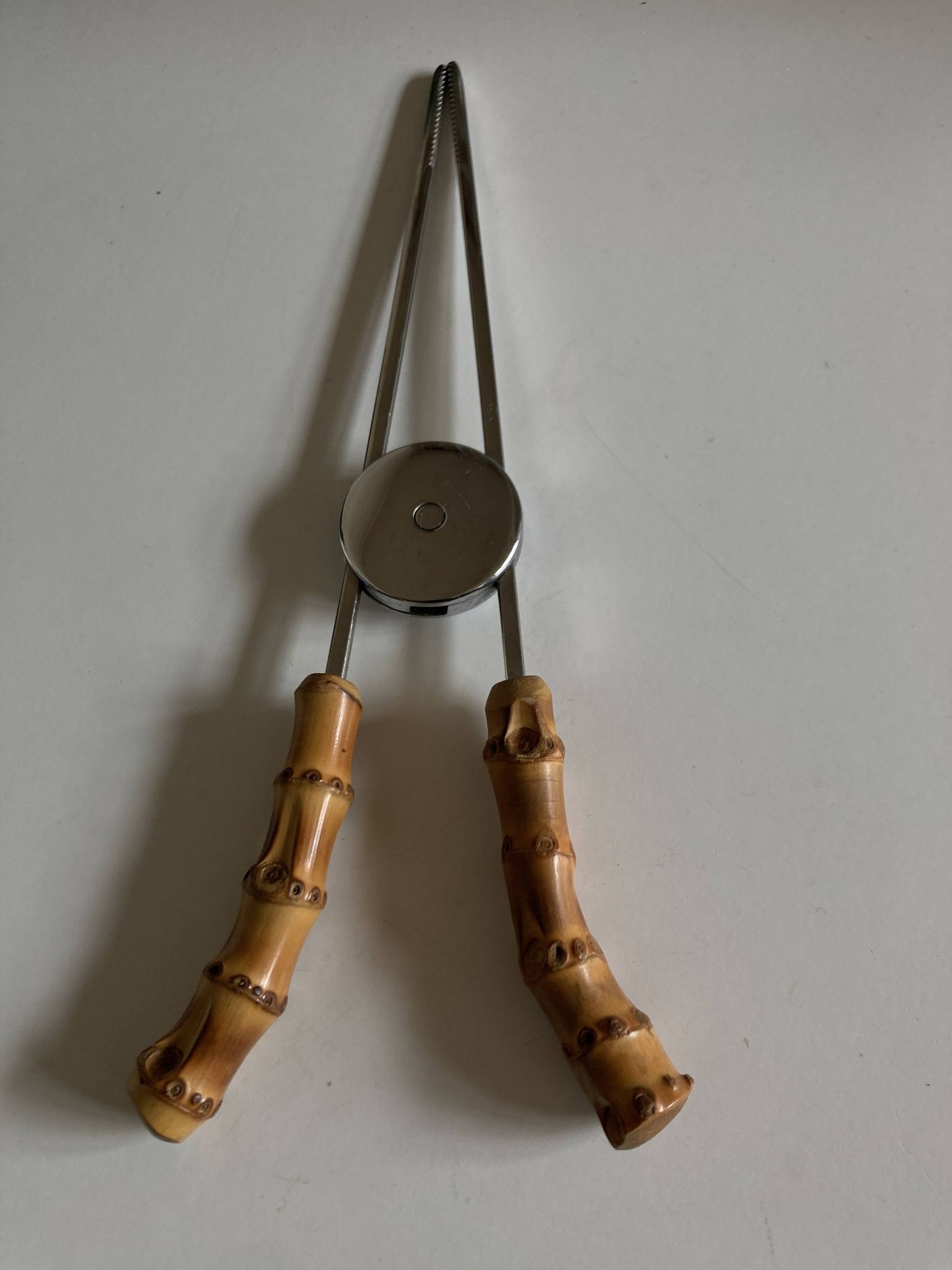 1960 dlg Adnet steel and bamboo ice tongs