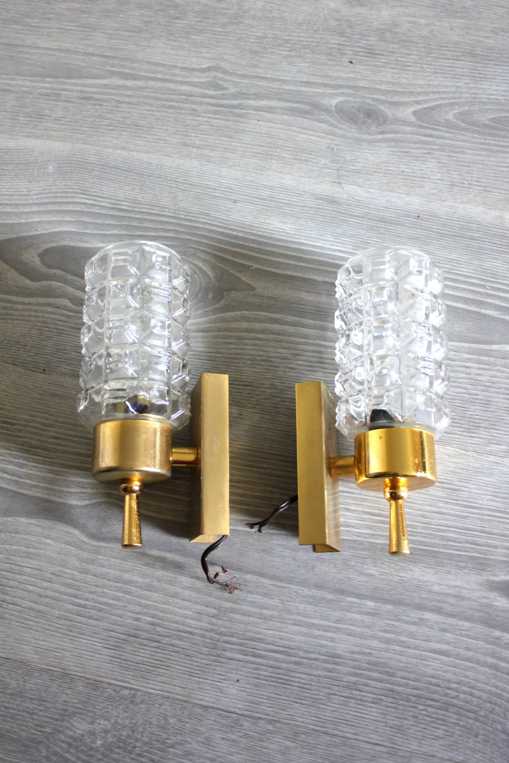 Pair of vintage wall sconces in gilded brass with moulded glass.