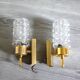 Pair of vintage wall sconces in gilded brass with moulded glass.