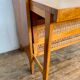 Modernist vintage chest of drawers in light chene has 3 drawers rattan top changing table