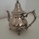 Oriental teapot in silver metal