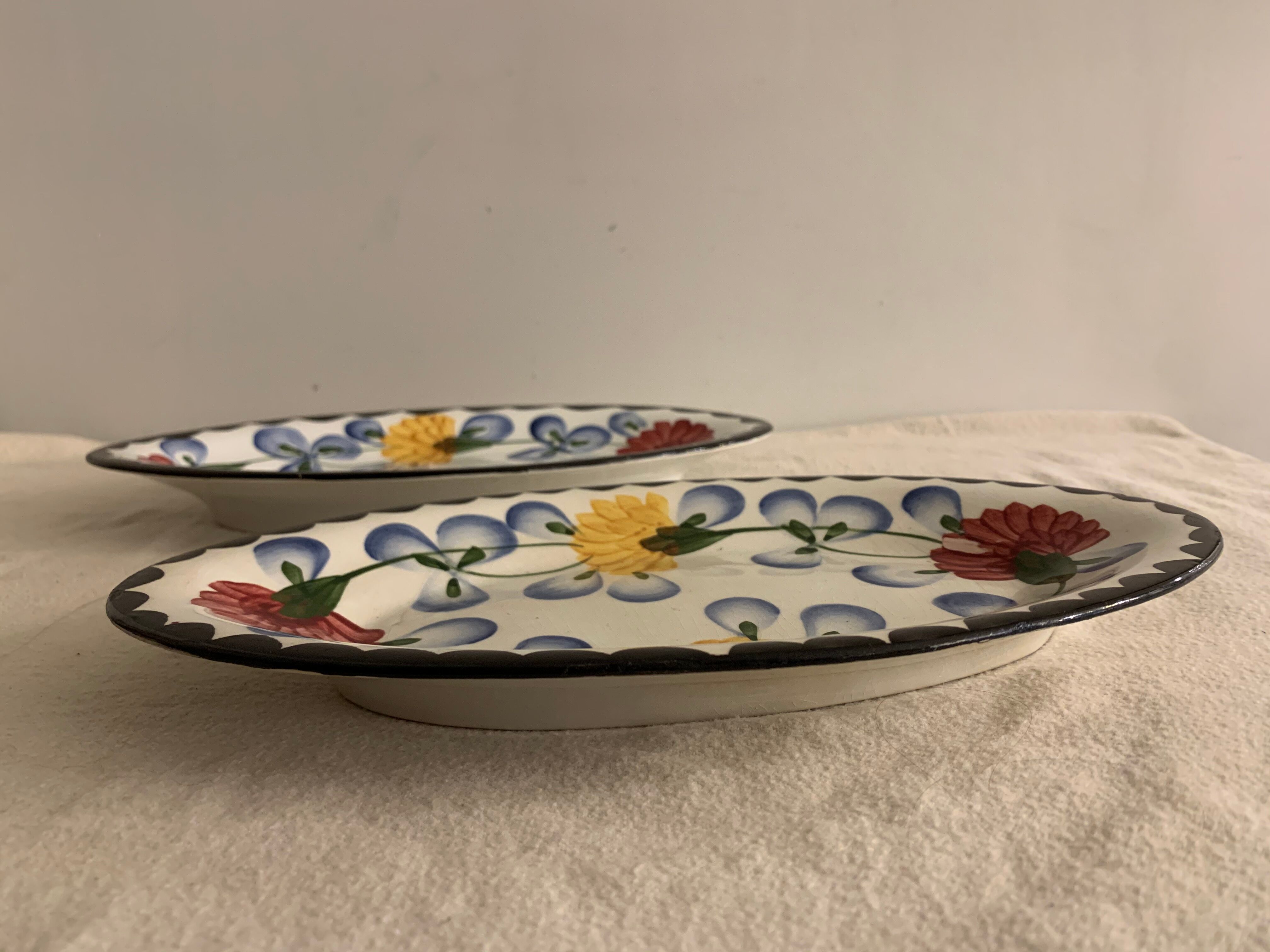 Pair of floral ravines in ancient earthenware Onnaing and CM Paris model Clovers