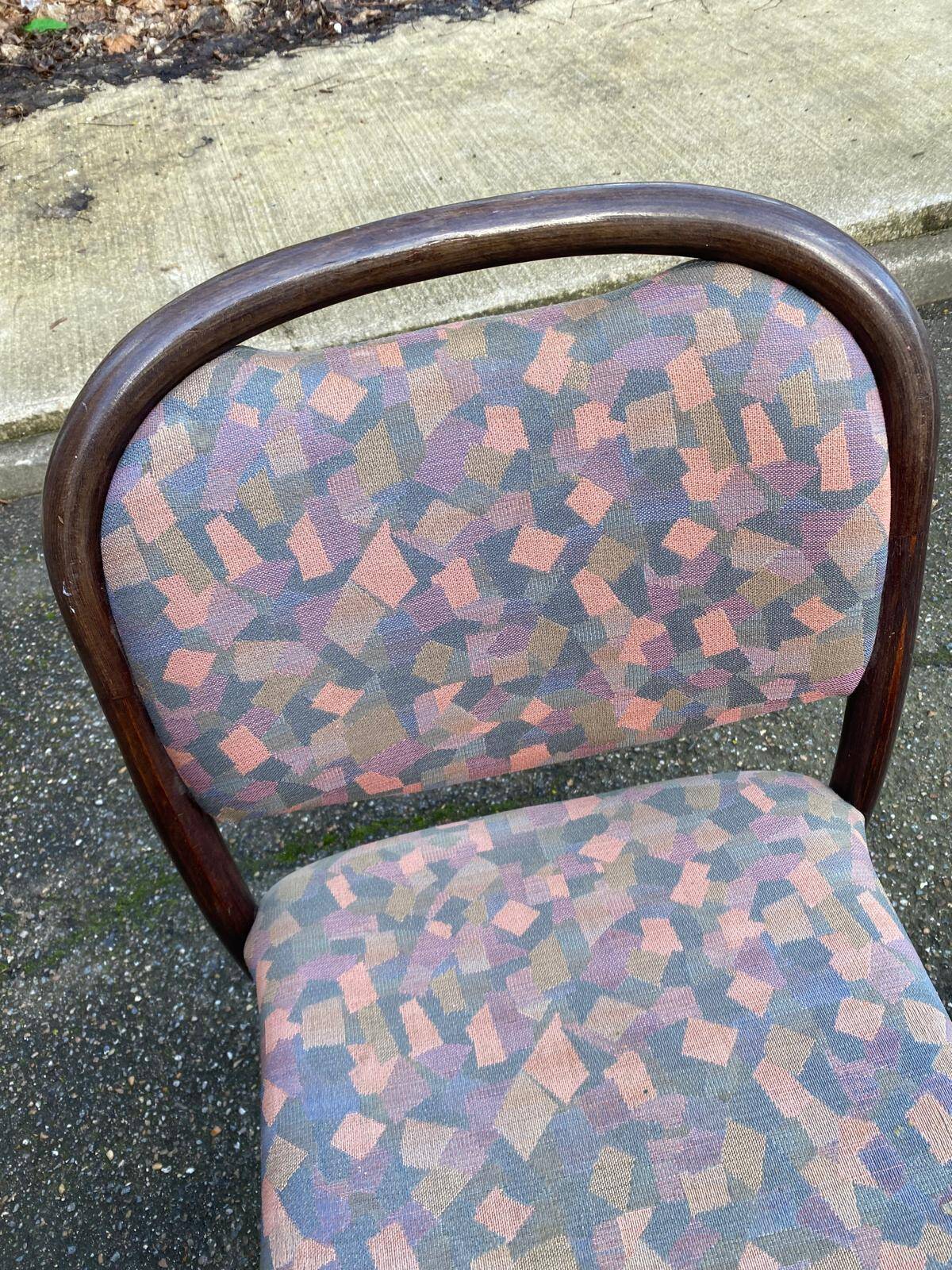 Scandinavian chair in curved solid teak wood and fabric.