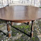Round wooden table with 1 integrated extension + 6 wooden and fabric chairs