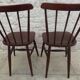 Paire de chaises à barette de style Baumann en bois patinés