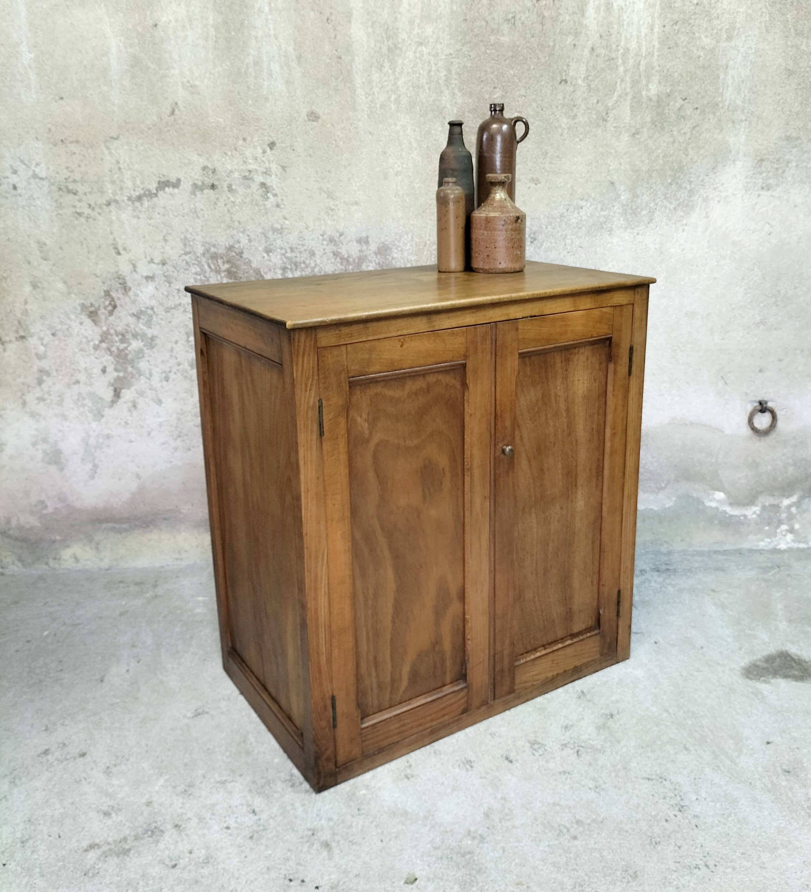 Small wooden sideboard with two doors.
