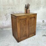 Small wooden sideboard with two doors.