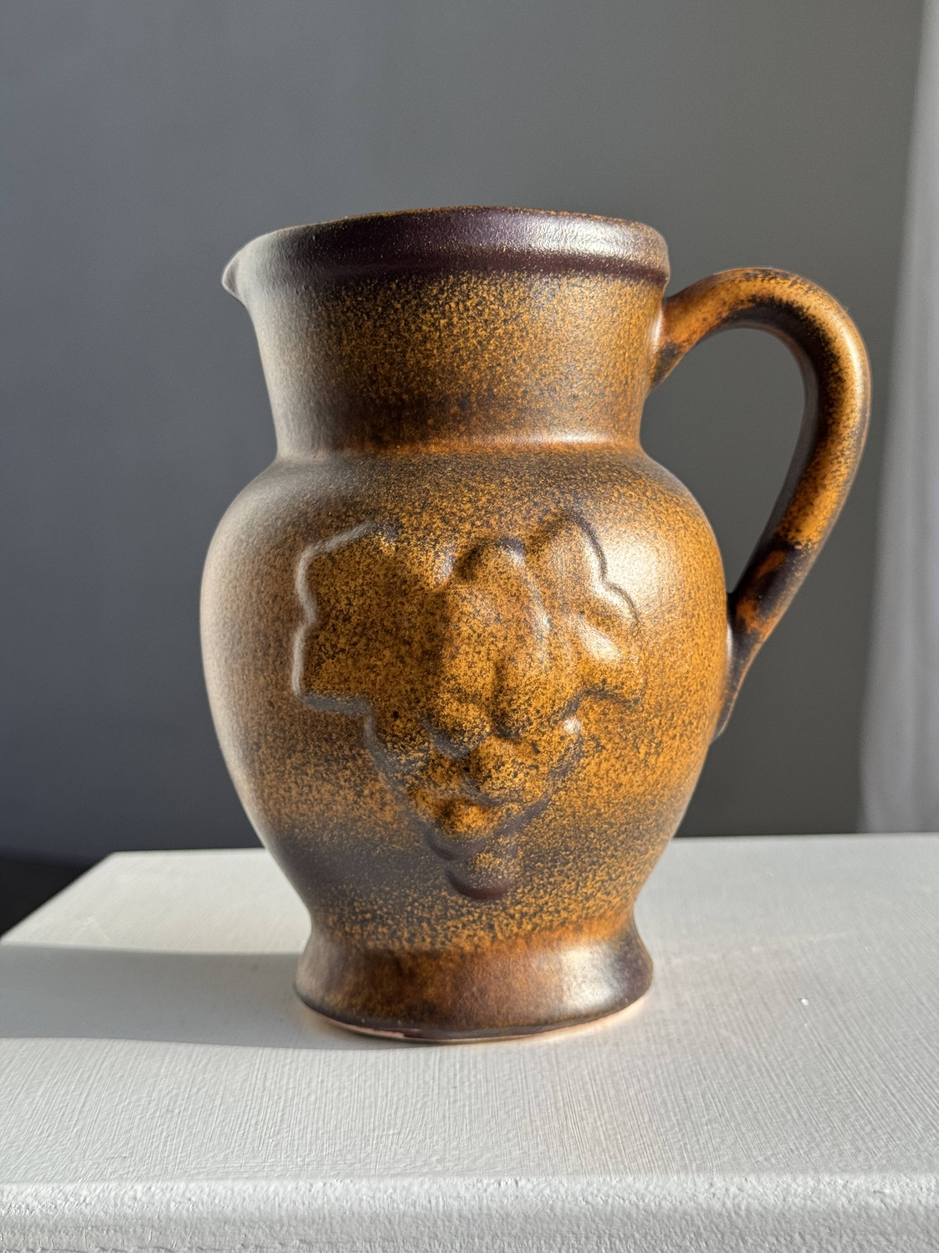 Speckled stoneware jug with grape pattern H17