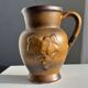 Speckled stoneware jug with grape pattern H17