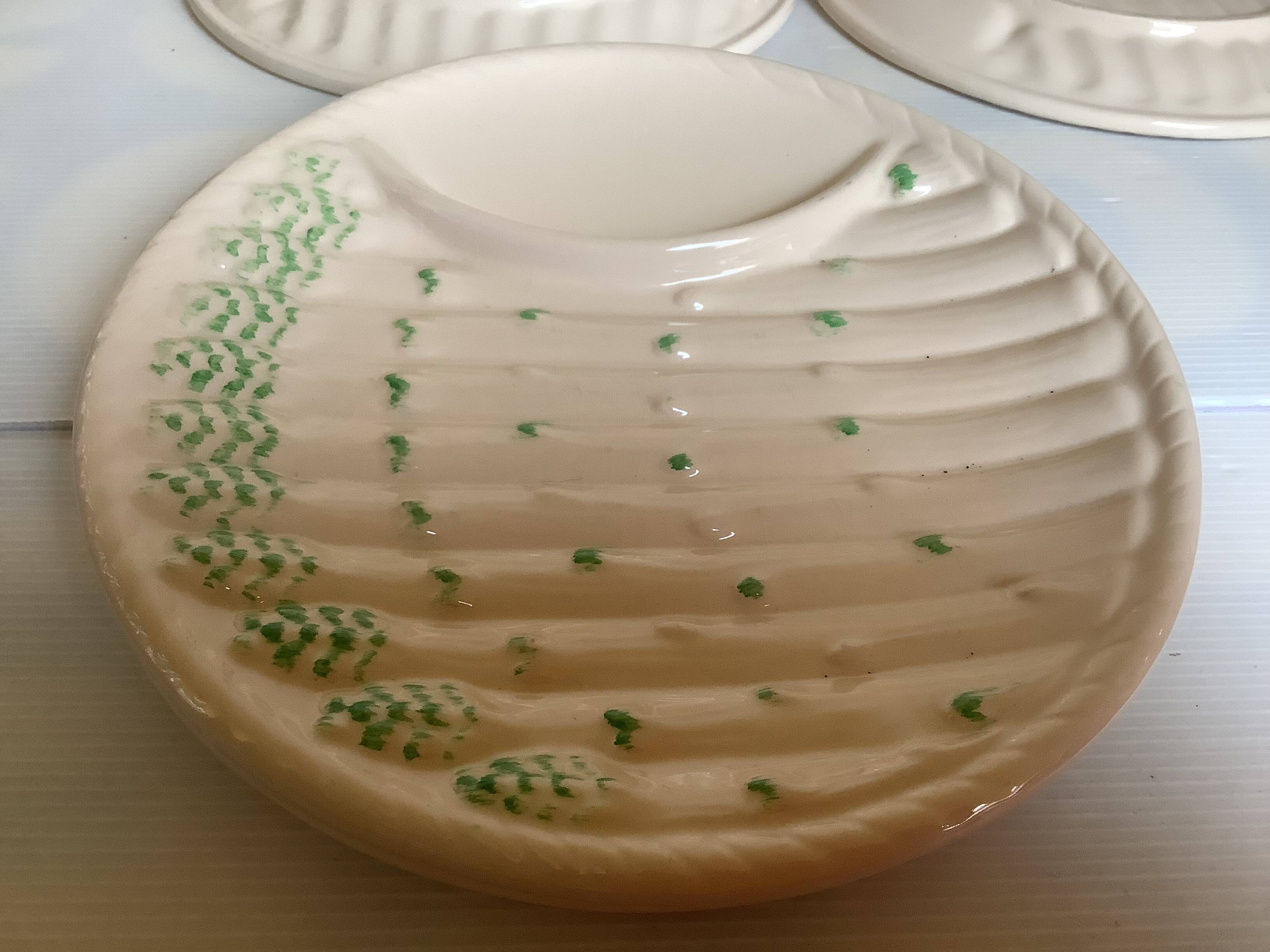 Six antique asparagus plates