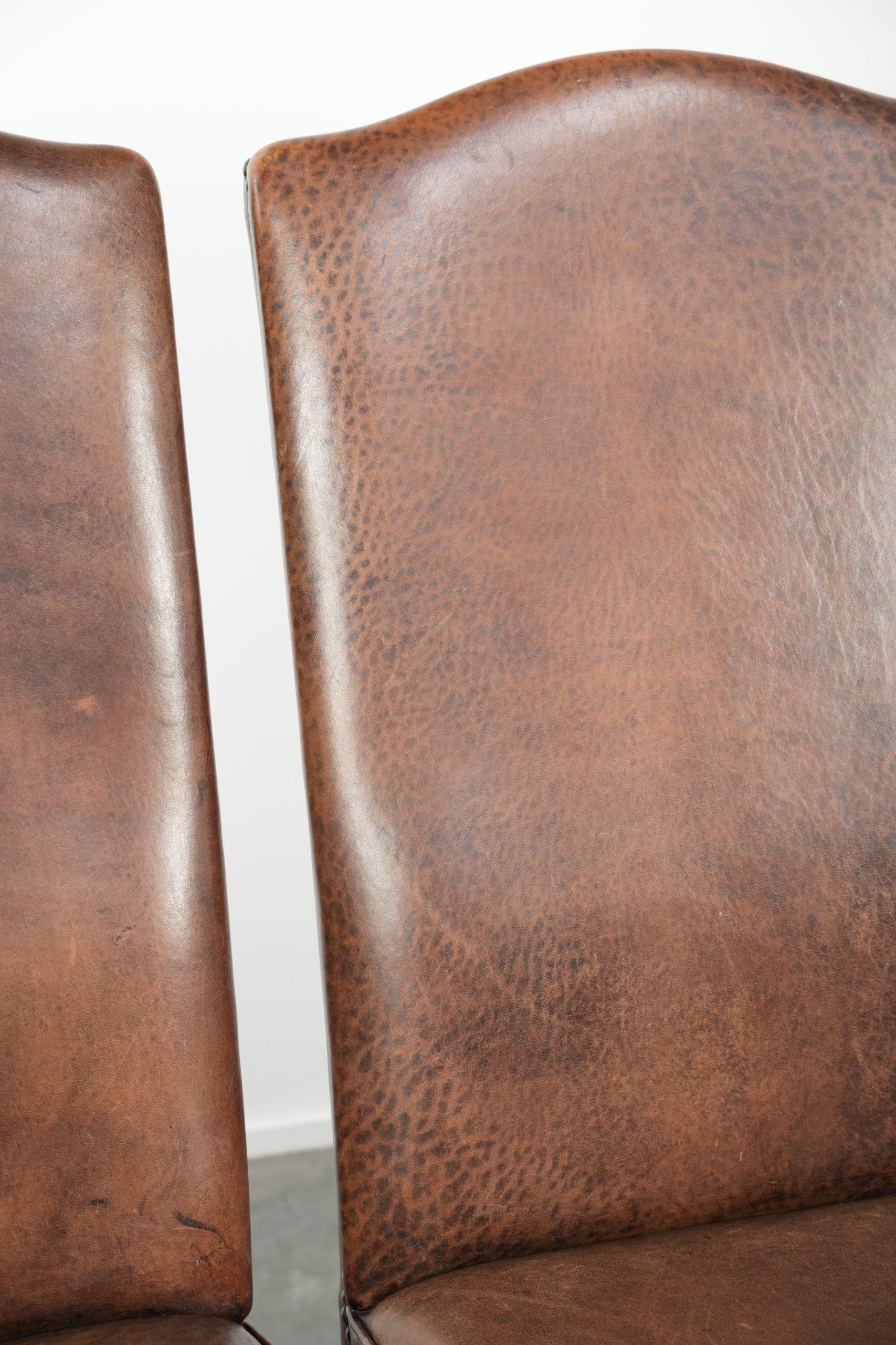 Vintage set of 4 dining chairs made of sheepskin leather with a high back