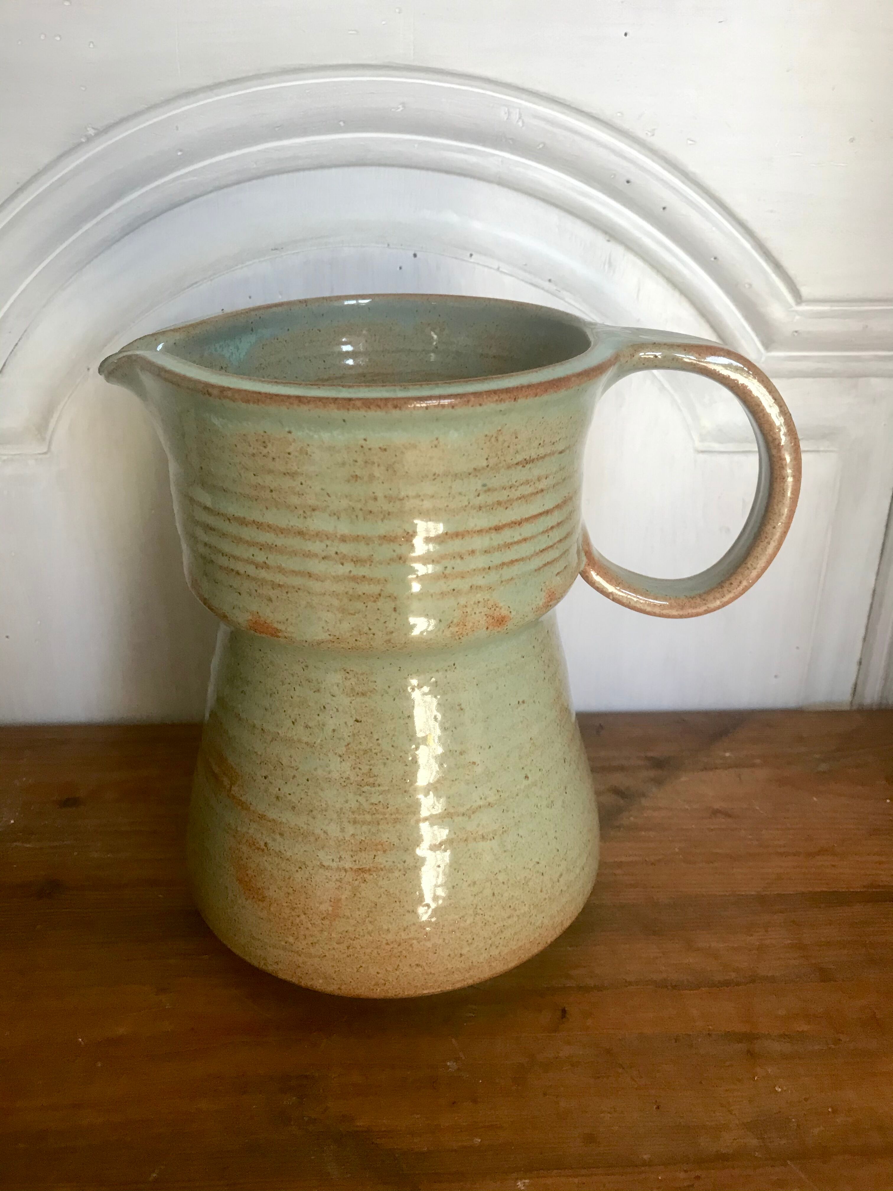 Pitcher and its vintage sandstone glasses