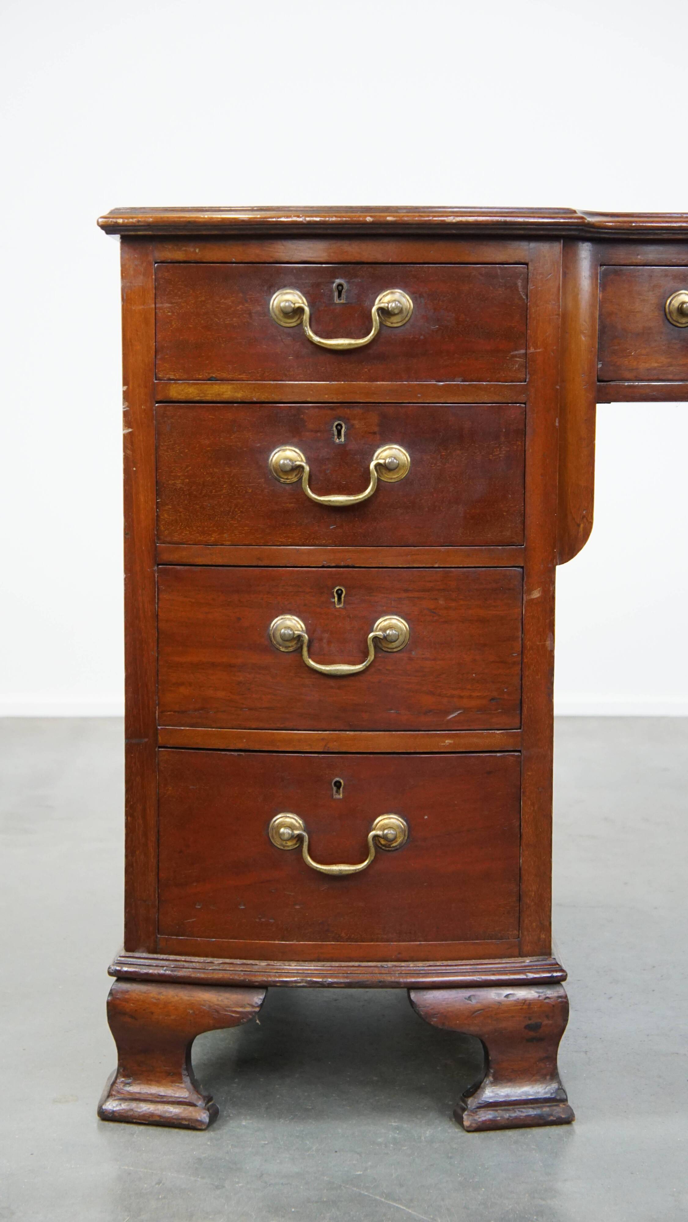 Antique wooden English desk from the late 19th century with a leather top