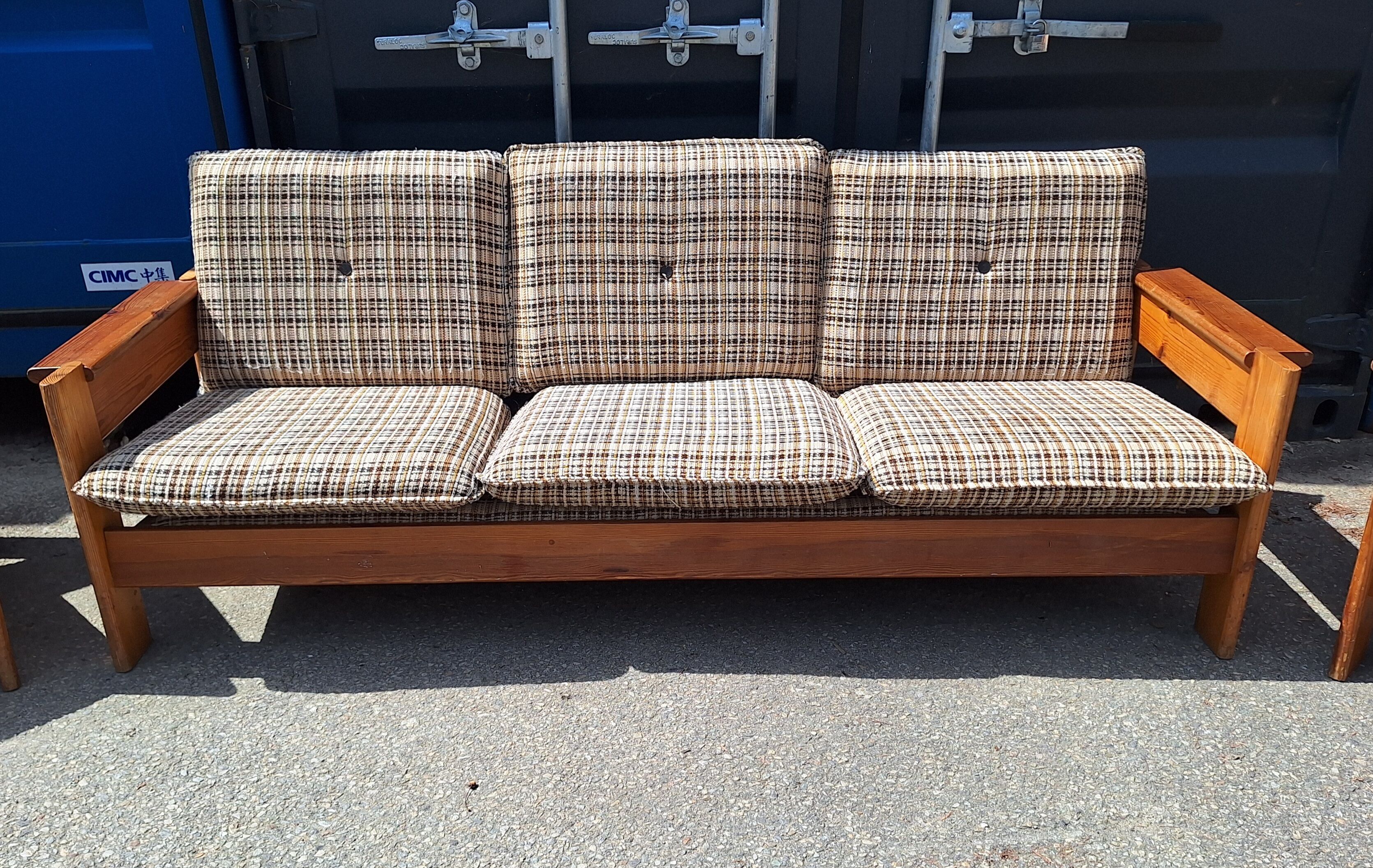 Brutalist-style bench and armchairs in 1970s pine.