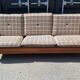 Brutalist-style bench and armchairs in 1970s pine.