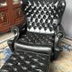 Chesterfield armchair and ottoman. Leather.