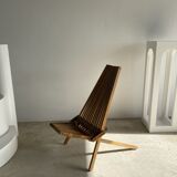 Foldable designer armchair in wooden slats