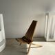 Foldable designer armchair in wooden slats