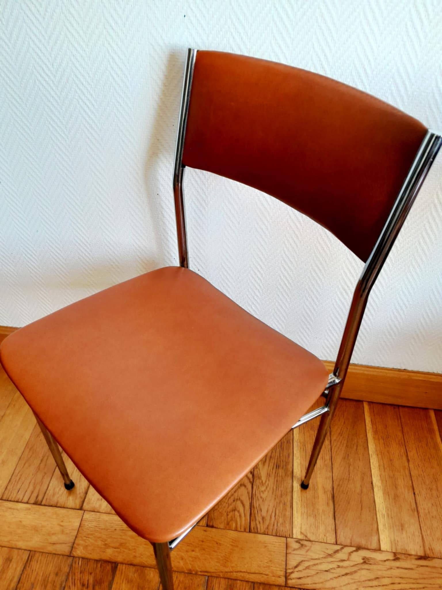 Three mid-century chairs in faux leather and chrome from the 1950s.