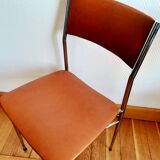 Three mid-century chairs in faux leather and chrome from the 1950s.