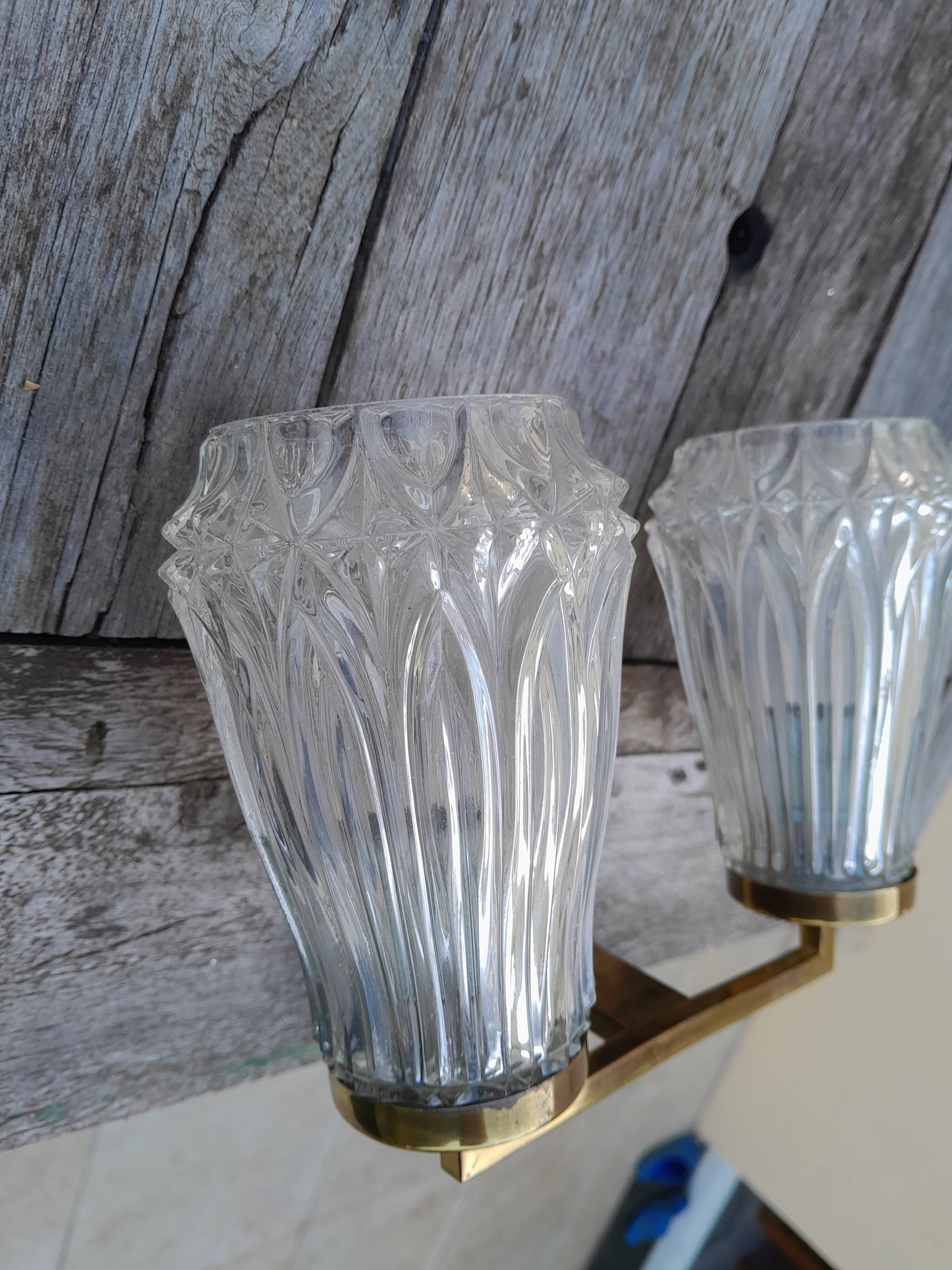 Pair of vintage wall lights from the 50s and 60s in brass glass