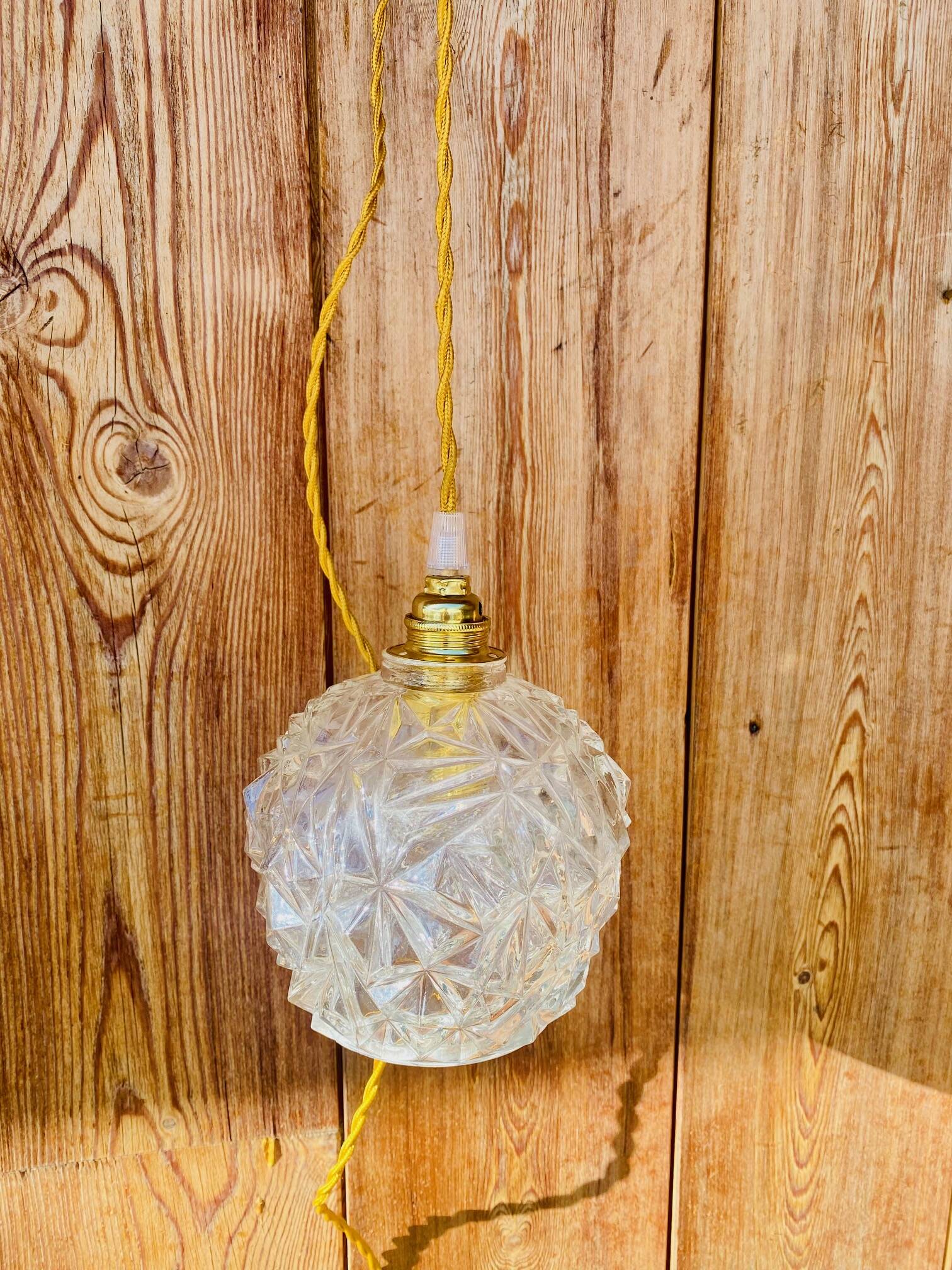 Globe pendant light in chiseled glass