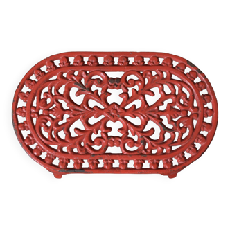 Red cast iron trivet